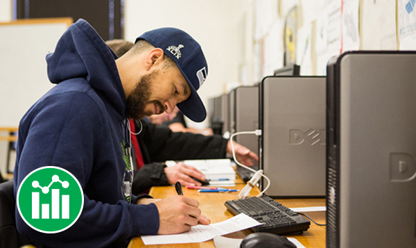 Accounting student writing on assignment