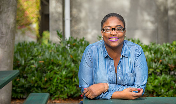  Business student sitting outside smiling 
