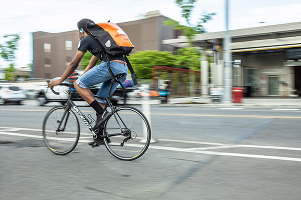 Student biking on Broadway campus at Seattle Central College